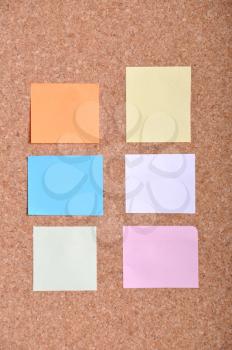 Royalty Free Photo of Sticky Notes on a Bulletin Board