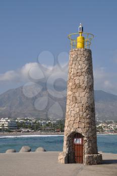 Royalty Free Photo of a Famous Lighthouse in Puerto Banus Marbella, Spain