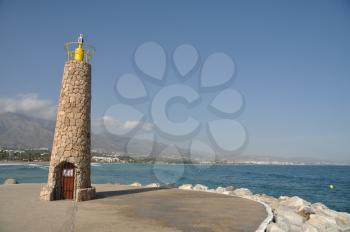 Royalty Free Photo of a Famous Lighthouse in Puerto Banus Marbella, Spain
