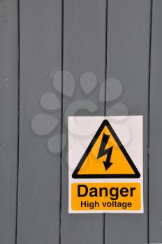 Royalty Free Photo of a High Voltage Danger Yellow Sign