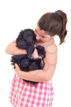 Royalty Free Photo of a Girl Playing With a Puppy