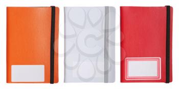 Royalty Free Photo of Three Colorful Notebooks