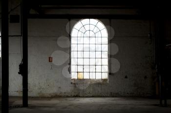 Window in an dark abandoned building
