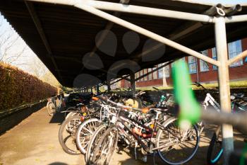 Bicycle parking at a school backyard on a sunny day