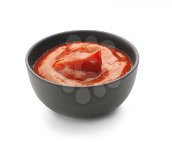 Tasty tomato sauce in bowl on white background�