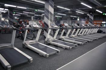 Modern equipment in new gym indoors�