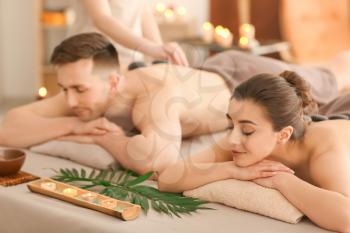 Young couple relaxing in spa salon�