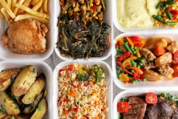 Plastic containers with delicious food as background. Delivery service�