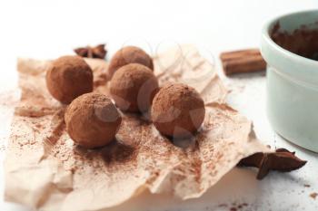 Tasty chocolate truffles on white table, closeup�