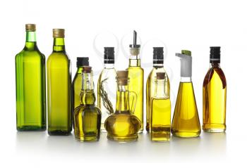 Glassware with olive oil on white background�