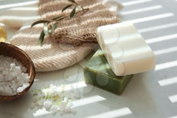 Bars of natural soap with olive extract and sea salt on table�