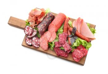 Assortment of delicious deli meats on wooden board, isolated on white�
