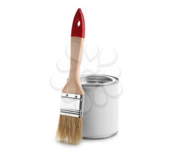 Can of paint and brush on white background�