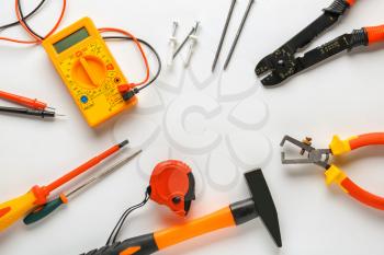 Different electrician's tools and supplies on white background�