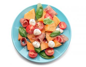 Delicious salad with melon and prosciutto on white background�