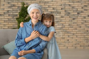 Little girl and her mother after chemotherapy at home�
