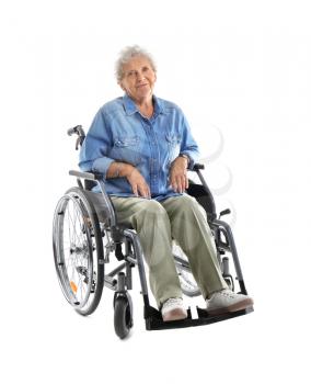 Senior woman in wheelchair on white background�