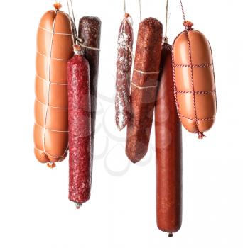 Different kinds of sausages on white background�