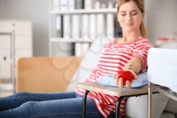 Woman donating blood in hospital�