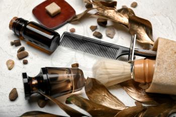 Composition with shaving accessories for men and cosmetics on white background�