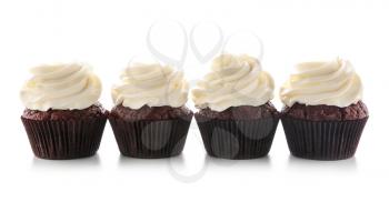 Tasty chocolate cupcakes on white background�
