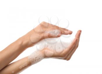 Female hands with soap foam on white background�
