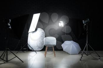 Modern photo studio with professional lighting equipment�