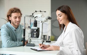 Man visiting ophthalmologist in clinic�