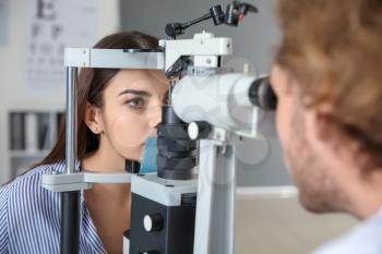 Young woman visiting ophthalmologist in clinic�