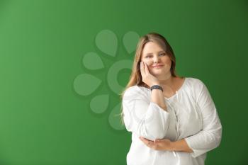 Beautiful plus size girl on color background. Concept of body positivity�