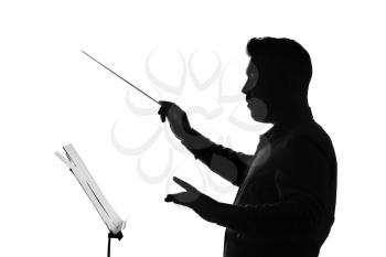 Silhouette of male orchestral conductor on white background�