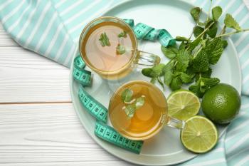 Cups of tea for weight loss on table�