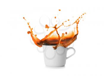 Splash of coffee in cup on white background�