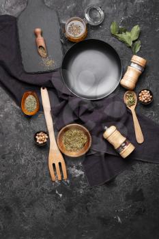 Set of kitchenware and spices on grunge background�