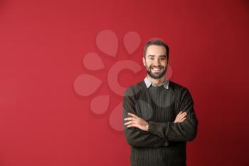 Portrait of young businessman on color background�