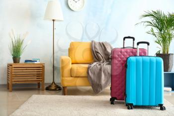 Packed suitcases in room. Travel concept�