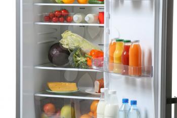 Open fridge full of different food�