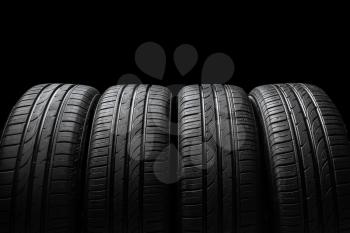 Car tires on dark background�