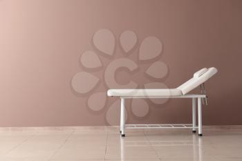 Treatment couch near color wall�