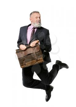 Jumping mature man with briefcase on white background�