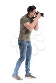 Handsome male photographer on white background�