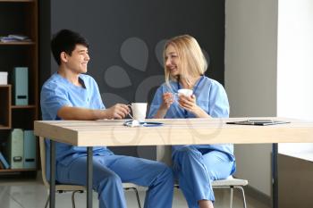 Young medical assistants having break during work in clinic�