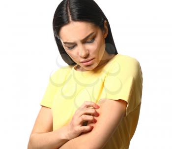 Young woman with skin allergy on white background�