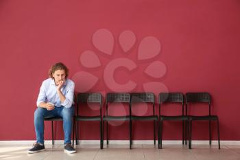 Young man waiting for job interview indoors�