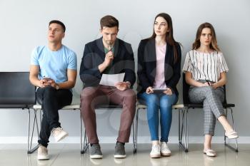 Young people waiting for job interview indoors�