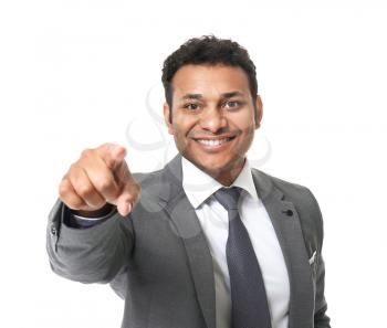 Portrait of handsome businessman pointing at viewer on white background�