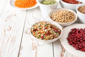 Assortment of legumes on white table�