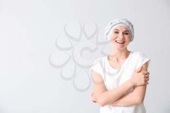 Woman after chemotherapy on light background�