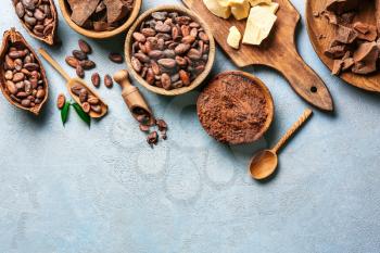 Different cocoa products on color background�