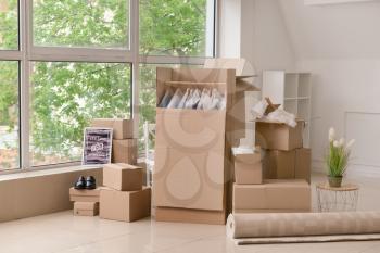 Moving boxes with belongings in room�